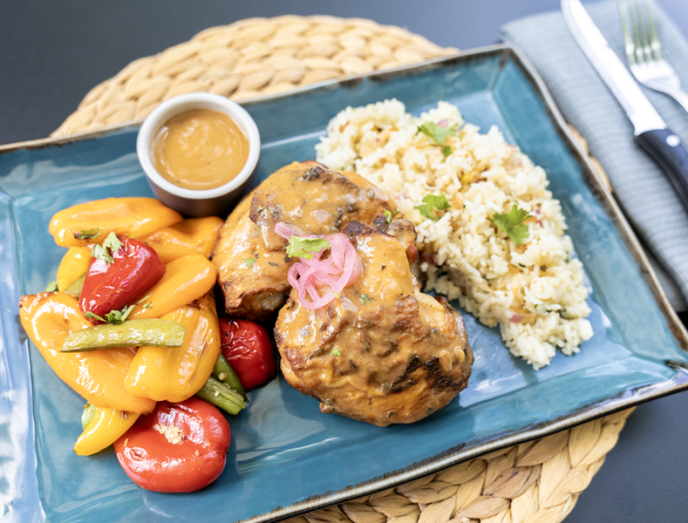 From Mozambique by way of Portugal, this bird is well traveled and well-seasoned. A vibrant blend of chilies, garlic, lemon, and herbs make for a smoky and tangy bite. Next to our Tropical Rice and roasted baby bell peppers with sugar snap peas, it's all yours this summer, and no passport required. 