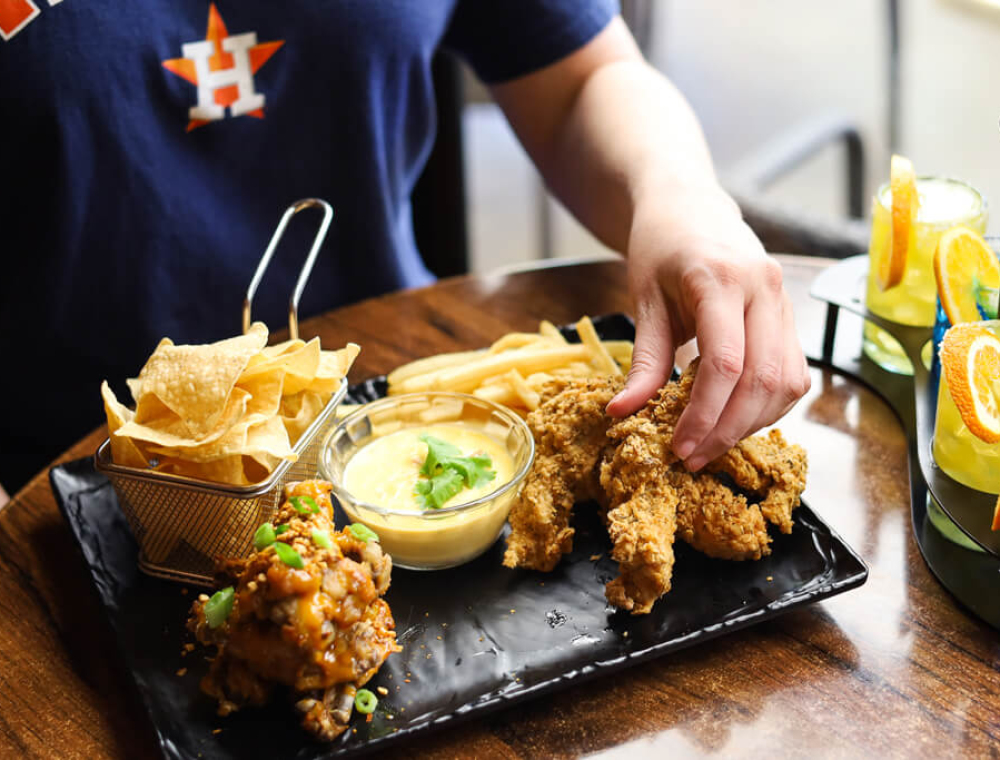 the bases are loaded! This board comes with portions of our Vindaloo Wings, BWC Chicken Tenders, BWC Queso and House Fries.