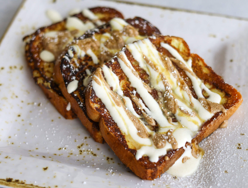 Texas-cut challah French toast, cream cheese icing, powdered sugar, pure maple syrup