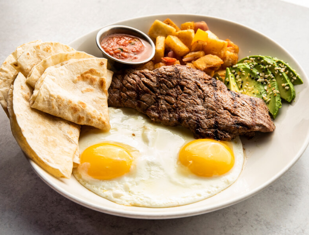 Seasoned strip steak, two extra-large eggs, breakfast potatoes, avocado, everything bagel spice, flour tortillas