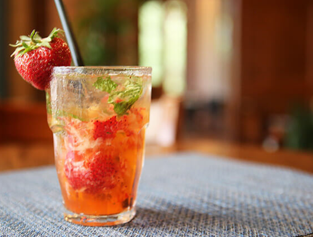 TX Whiskey, fresh-squeezed lime juice, seasonal fruit, mint leaves, simple syrup