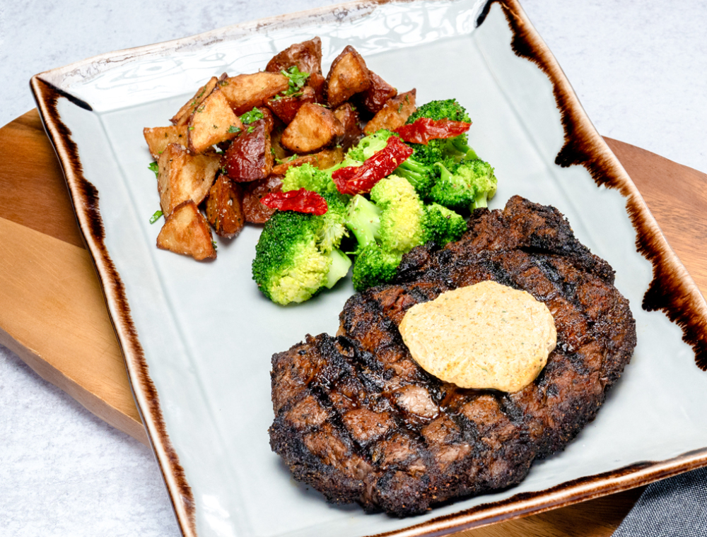 Certified angus beef ribeye, broccoli, oven-roasted potatoes, espresso garlic butter <br>Featuring GEVA Coffee