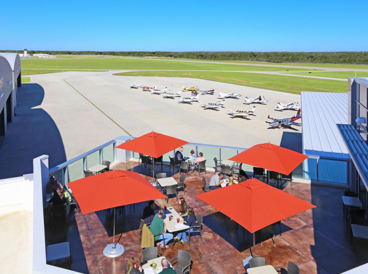 Spacious patio with panoramic views of the runway and ramp.