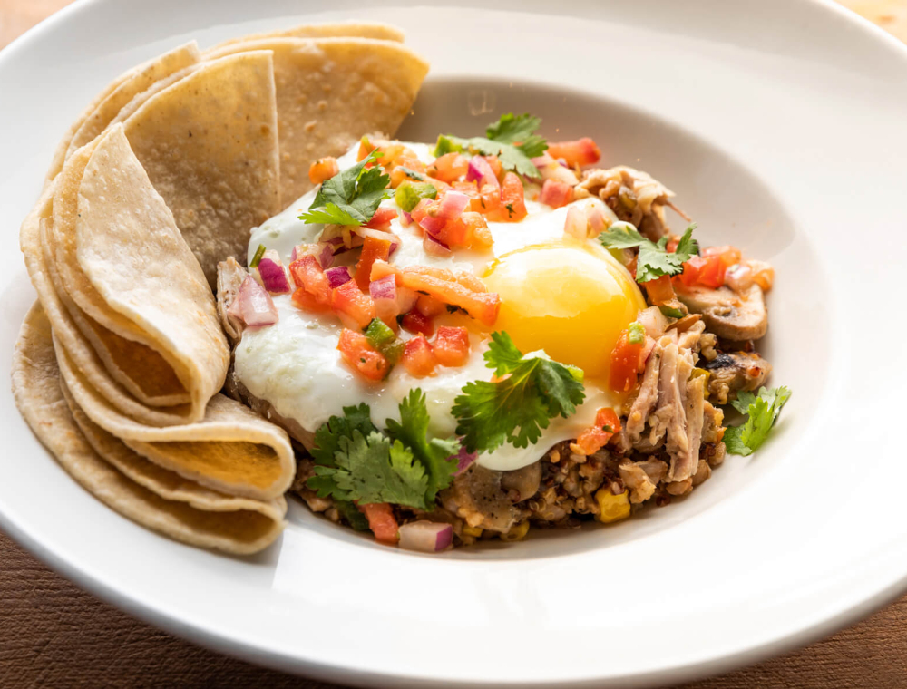 Pulled pork, extra-large egg your way, ancient grains, mushrooms, roasted corn, black beans, jalapeños, pico de gallo, cilantro, corn tortillas