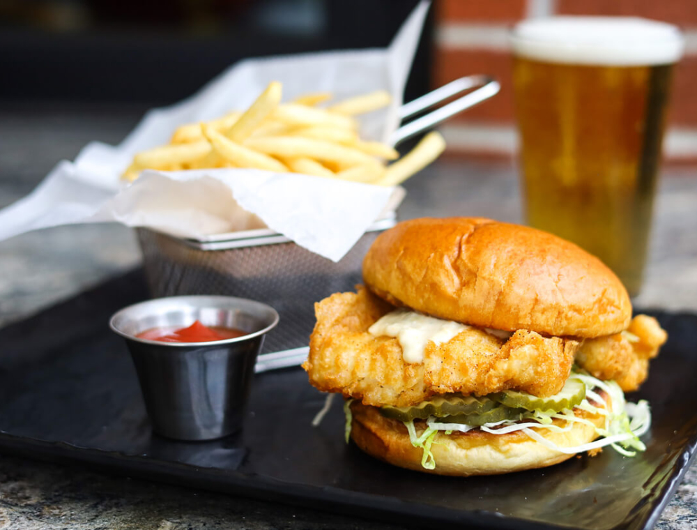 Beer-battered cod with tartar sauce, lettuce, pickles between a brioche bun and served with skinny fries. It’s a sandwich we can’t refuse!