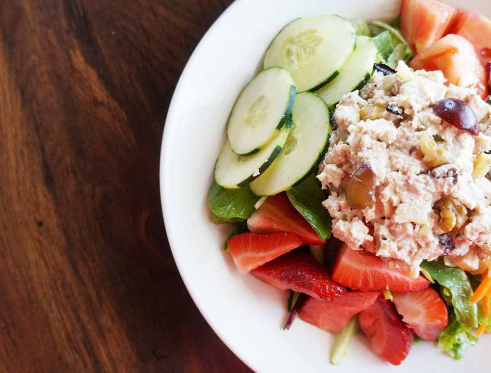 The Legal Eagle Salad flew in just in time for summer. This bright, fresh salad features our chunky chicken salad, spicy walnuts, grapes, strawberries, cucumber, tomatoes, carrots, mixed greens and lemon Otis dressing.